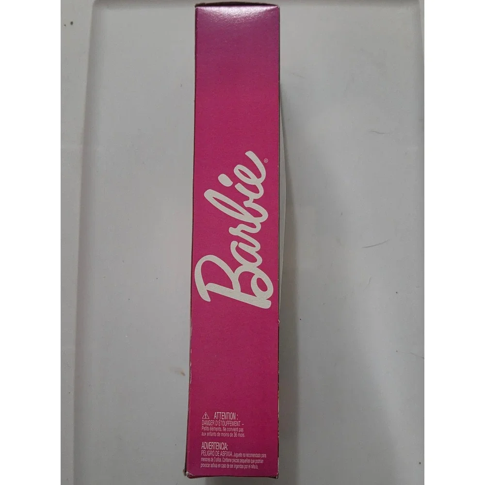Barbie unwrap magic